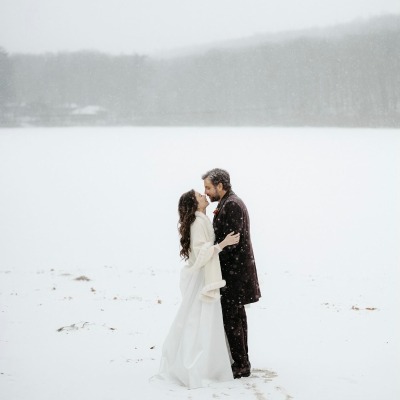 Josh Radnor and Jordana Jacob's in the middle of the snow-filled area.